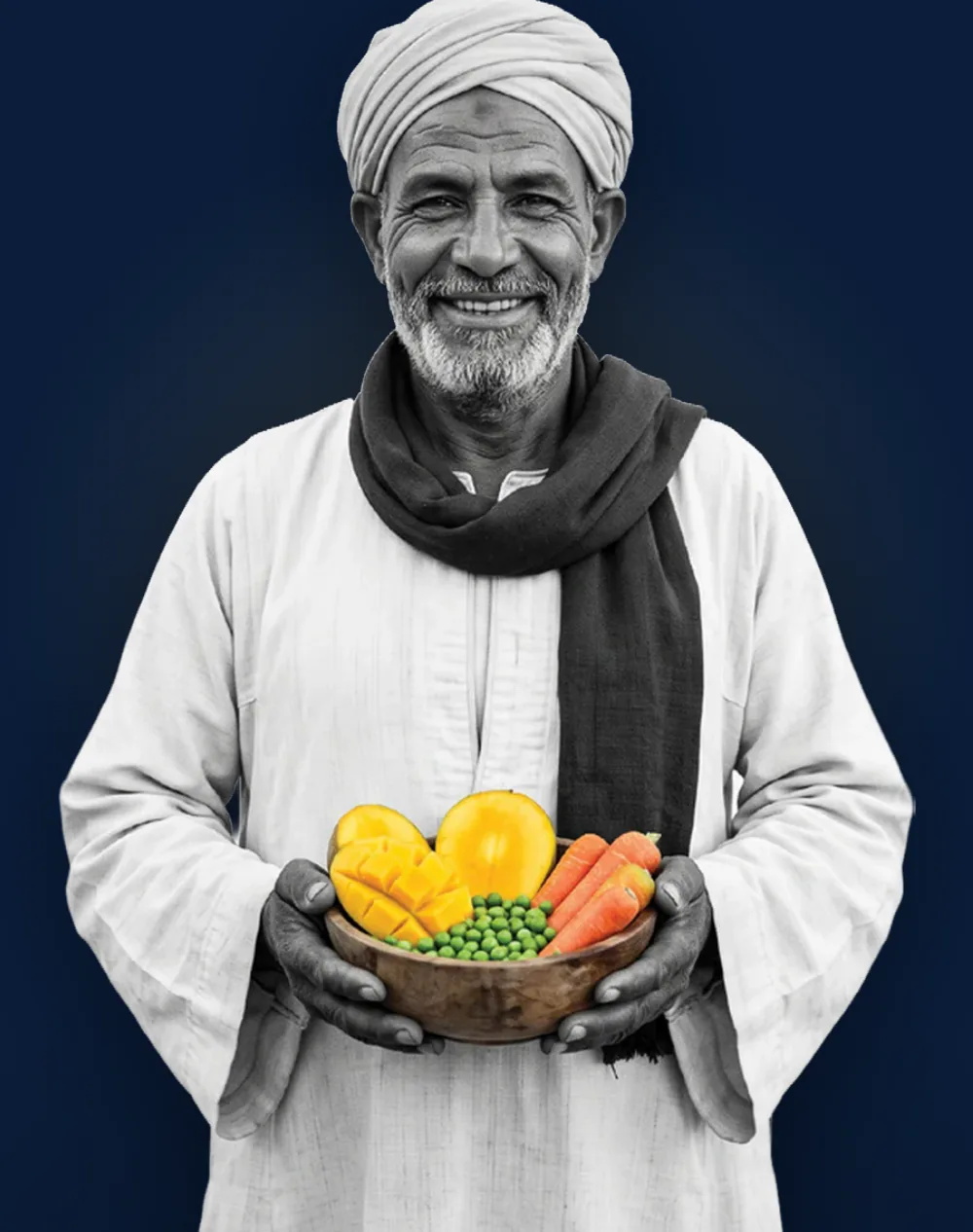 An Egyptian grower holding a bowl of mango, peas and carrots